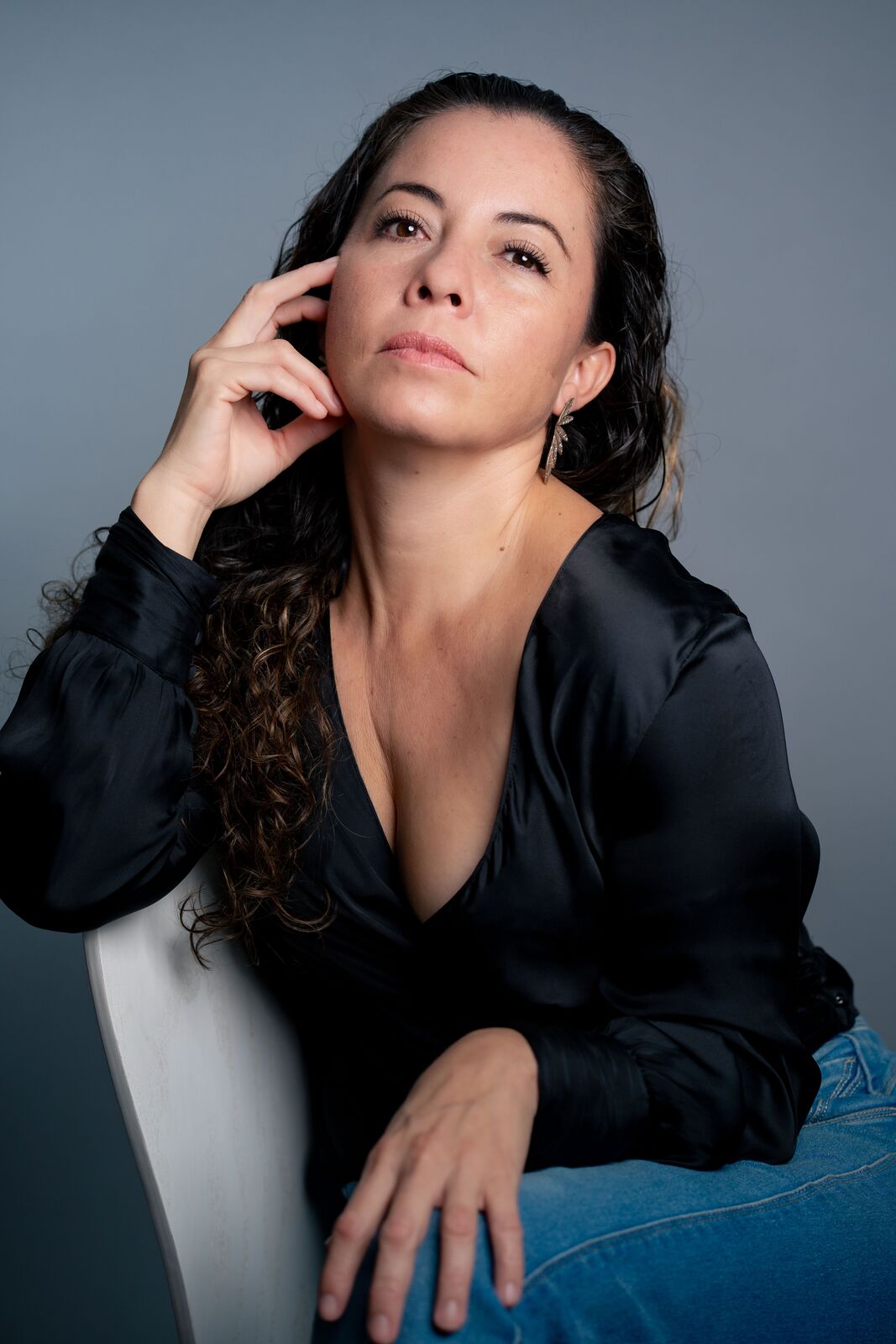 Alpha in a black blouse, studio portrait