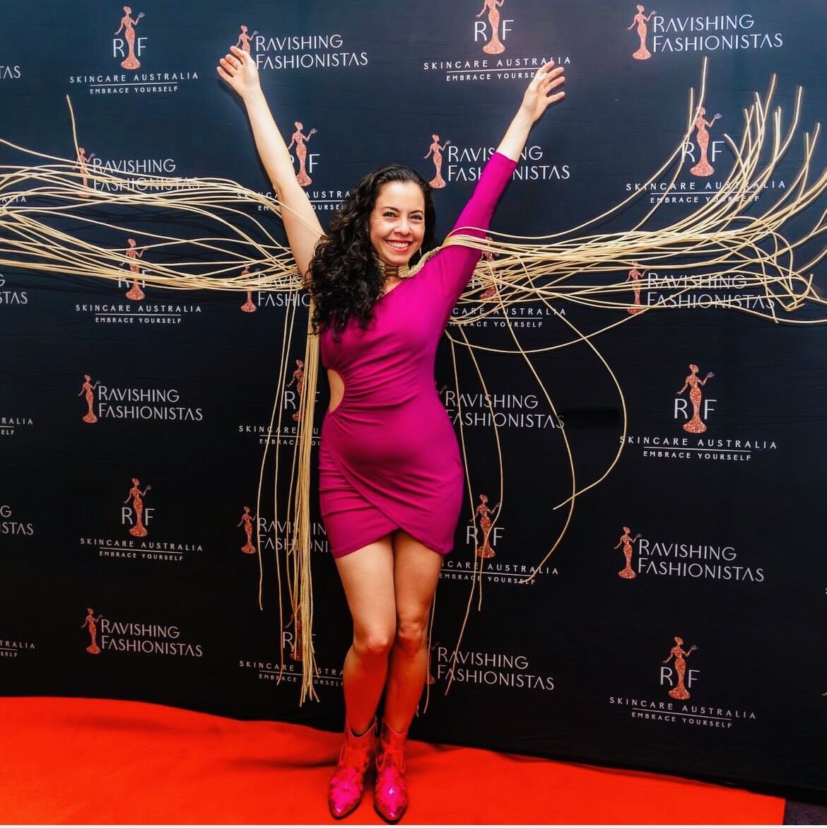 Alpha on the red carpet with wearable art wings