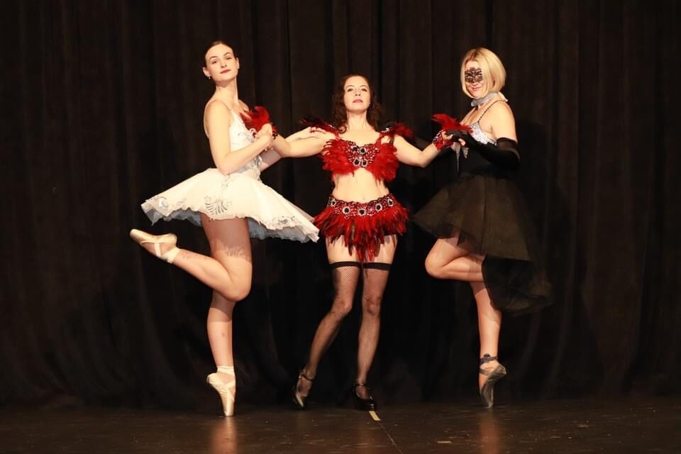 Three dancers on stage