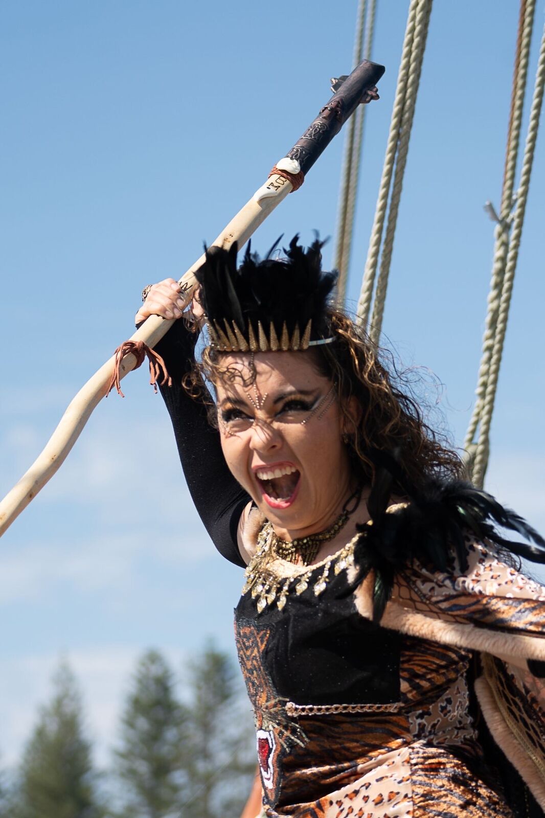 Alpha in character as a warrior, holding a spear